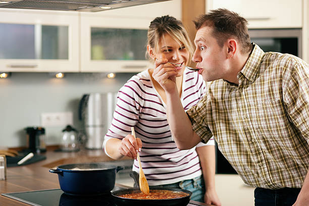 istock Cooking couple - tasting the sauce 97999657