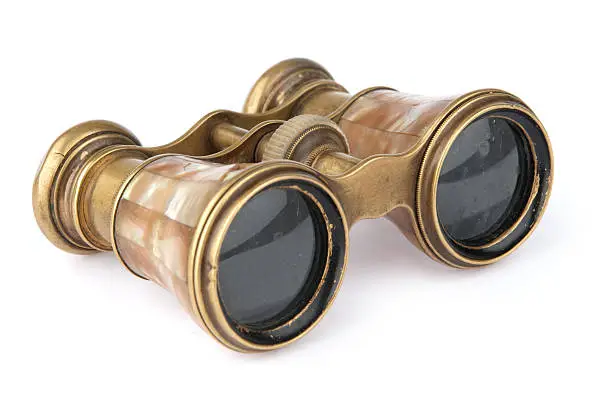 Photo of Pair of vintage binoculars isolated on white