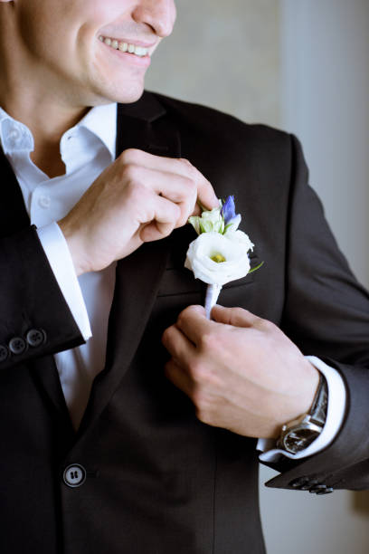 istock Groom is wearing a suit indoors 979997136