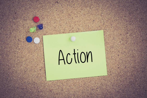 istock Action written on sticky note pinned on pinboard 979998862