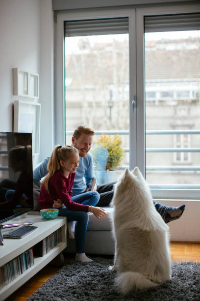 istock Dad and daughter with dog 980002320