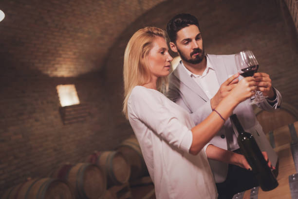 istock Wine loving couple degustating wines 980002906
