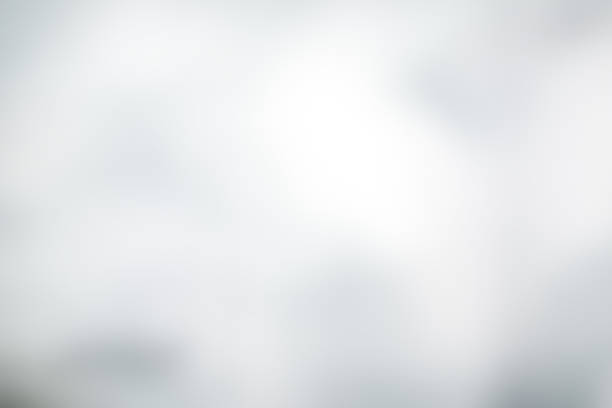 istock white blurred backdrop of nature, circle white wallpaper, gray bokeh background 980004034