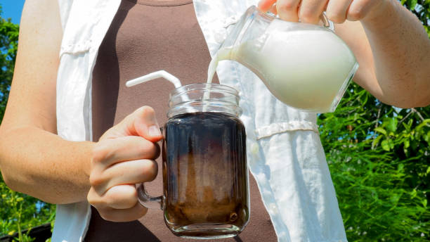 istock Iced coffee in woman's hand 980008568