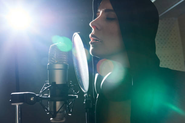 istock Amazing girl singing in back lit 980011340