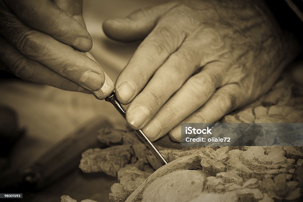 Artist's Hands Carving Closeup, Sepia Toned  Art Stock Photo