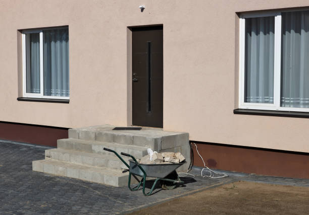 istock A wheelbarrow with stones near a rural house under construction 980017470