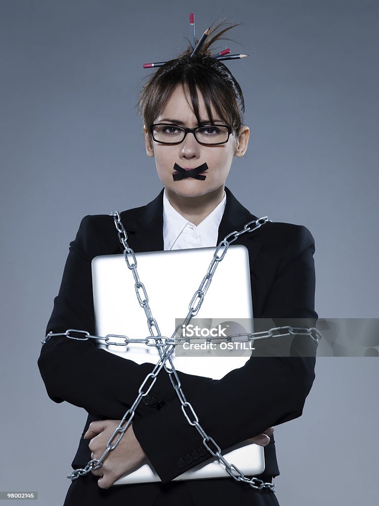 business woman chain to a laptop computer  Emotional Stress Stock Photo