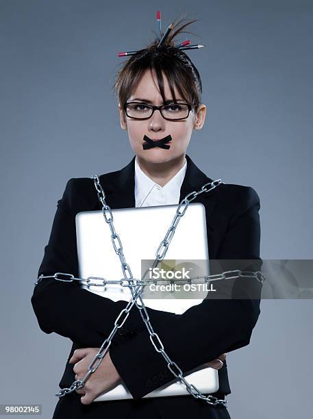 Business Woman Chain To A Laptop Computer Stock Photo - Download Image Now - Emotional Stress, A Helping Hand, Adult