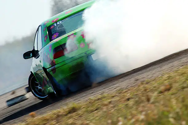 Photo of Car drifting on a race track