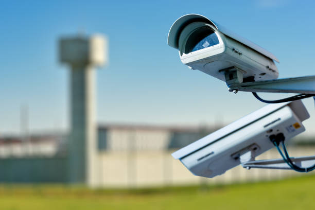 security cctv camera or surveillance system with prison on blurry background - honor guard imagens e fotografias de stock