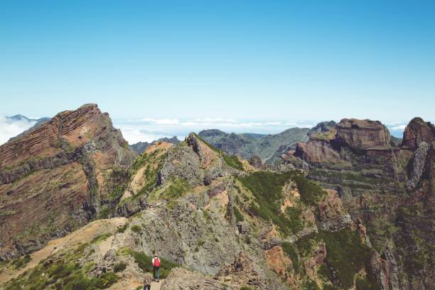 Hipster Group young man of hiking walking with backpack enjoying hiker on peak big mountains. Tourist traveler on background valley landscape view. country Europe. travel concept.