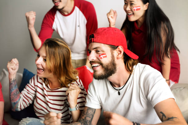 istock Friends cheering world cup with painted flag 980060848