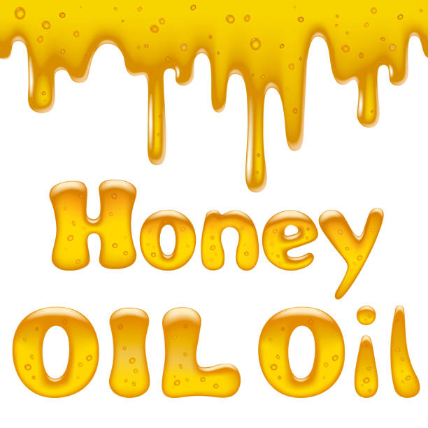 istock Flowing down yellow viscous liquid with honey and oil inscription 980061320