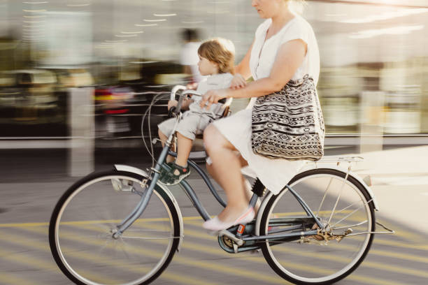 istock Mother With Her Son on a Bicycle 980061362