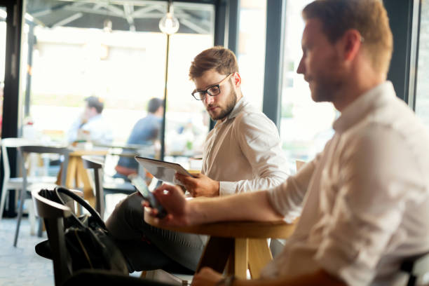 istock Business people at restaurant together 980067054