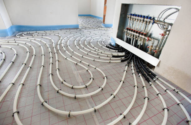 pipes of under floor heating in construction of new residential house stock photo