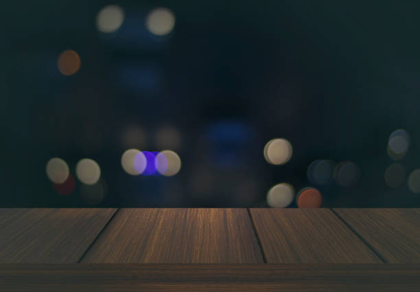istock wood table floor background  on night bokeh background can be used display product 980075260