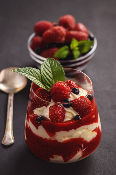 istock Strawberry mascarpone mousse dessert, on black background. 980096484