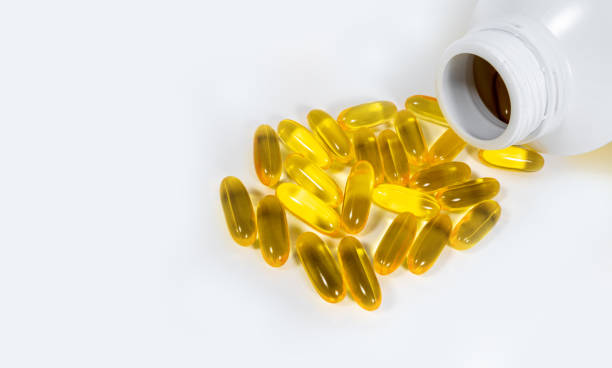 istock evening primrose oil on white isolated background. 980097058