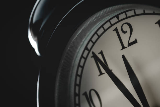 istock close up to vintage clock face in dark tone 980099356