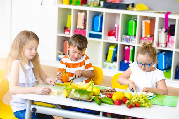 istock Students prepare their healthy snack themselves 980101072
