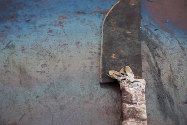 istock Vintage butcher cleaver on grunge rusty table, space for text or menu 980105882