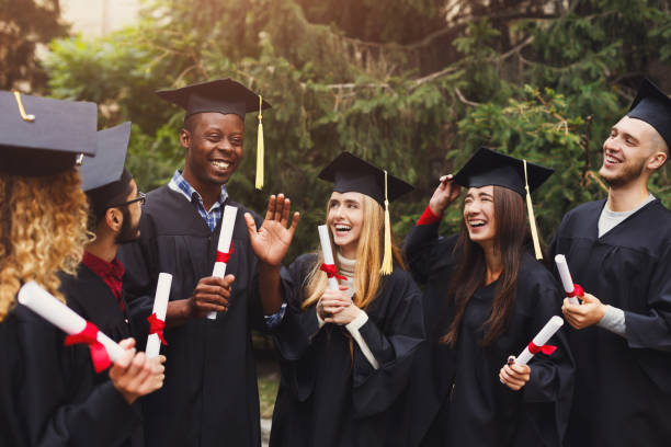 istock Group of multiethnic students on graduation day 980106680