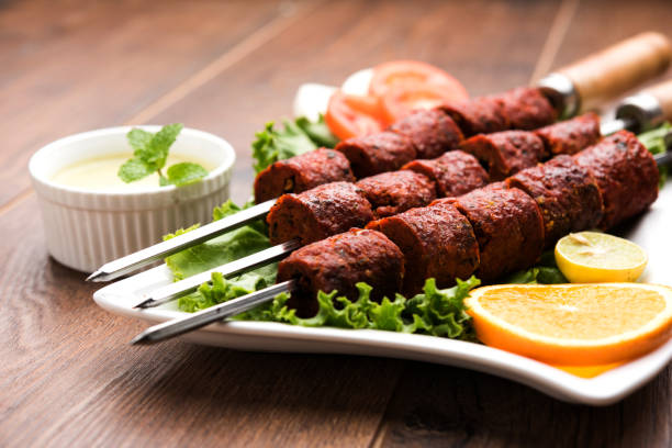 istock Indian Mutton Seekh Kabab served with green salad, selective focus 980110786