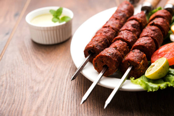 istock Indian Mutton Seekh Kabab served with green salad, selective focus 980111118