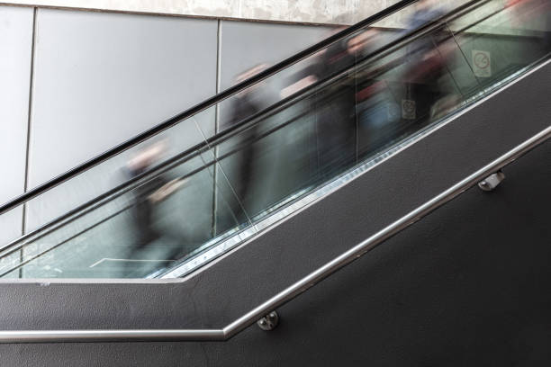 istock Blurred motion of people on escalator in Melbourne CBD 980113666