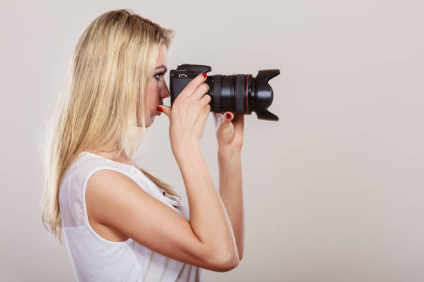istock Beautiful woman with camera. 980113840