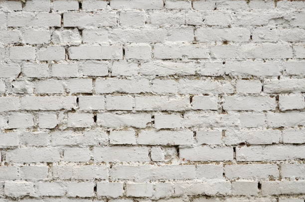 istock Brick wall painted in white color 980114160