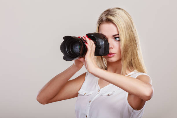 istock Beautiful woman with camera. 980118166