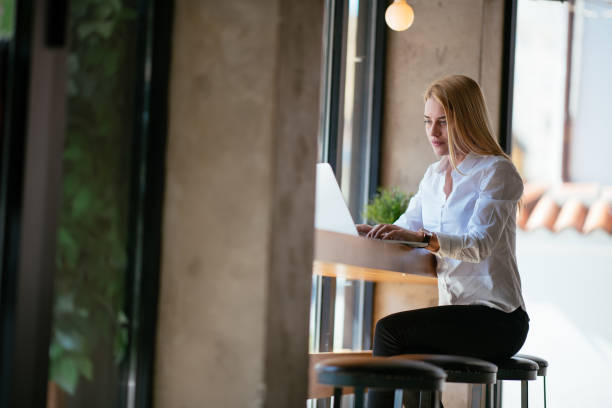 istock Woman working in cafe bar 980121898