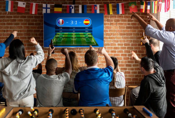 istock Friends cheering sport at bar together 980122698