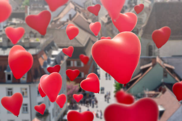 istock flying heart shape balloons over the city 980128014