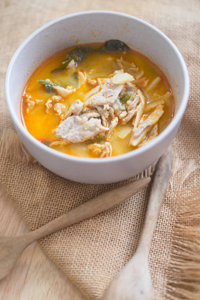 istock Thai hot and spicy curry with chicken and bamboo shoot in white bowl 980130714