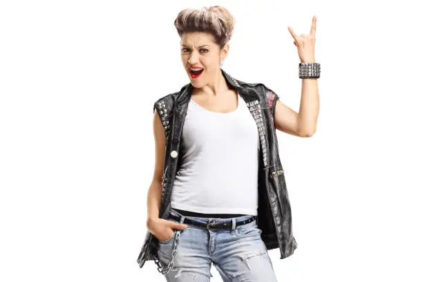 Female punker making a rock hand gesture isolated on white background
