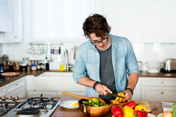 istock Caucasian man cooking in the kitchen 980131556