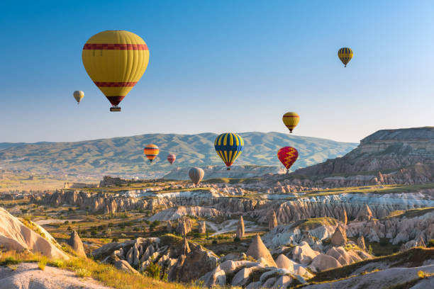 istock Hot air balloons flying over Cappadocia, Turkey 980133378