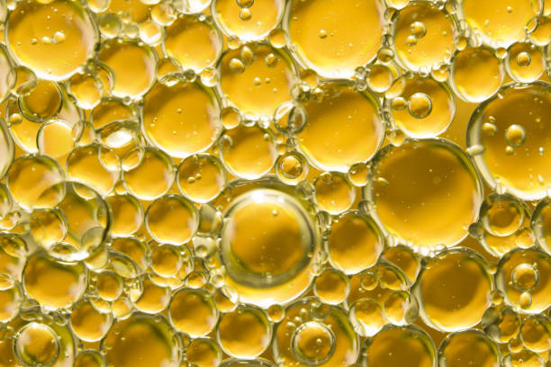 istock golden yellow bubble oil, abstract background 980134430