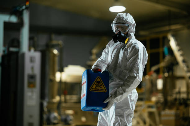 istock Factory worker wearing radiation protection suit 980136048