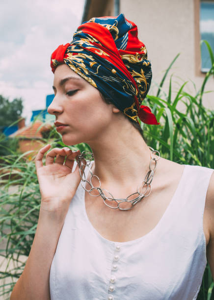 istock Woman wearing colored turban 980136282