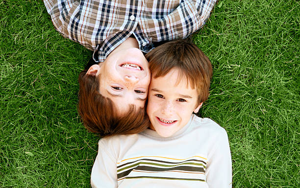 istock Boys Laying in the Grass 98013900