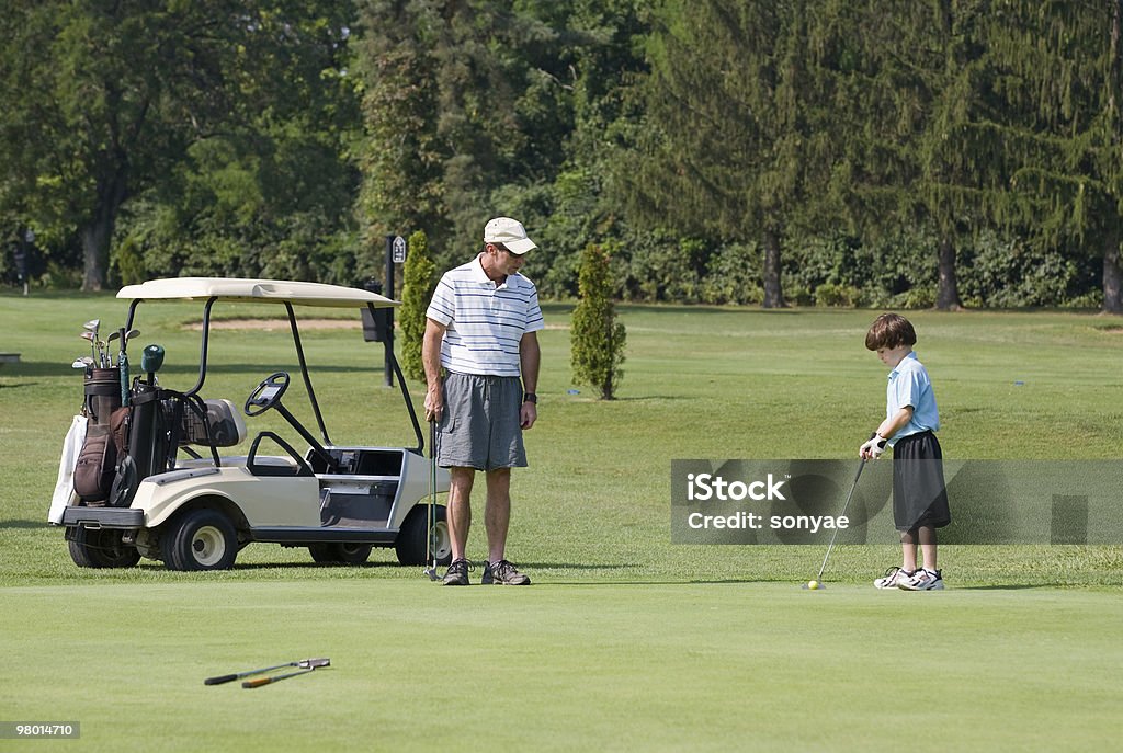 Father and Son Playing Golf  Activity Stock Photo