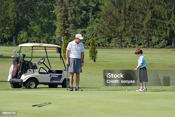 Father And Son Playing Golf Stock Photo - Download Image Now - Activity, Adult, Boys