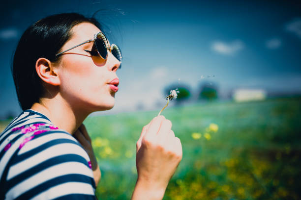 istock a young woman in the spring 980151728