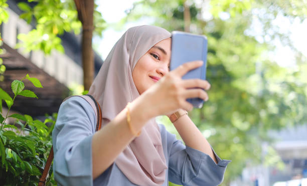 istock Asian woman taking a selfie 980168018