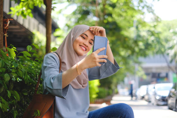 istock Muslim woman taking a selfie 980168056